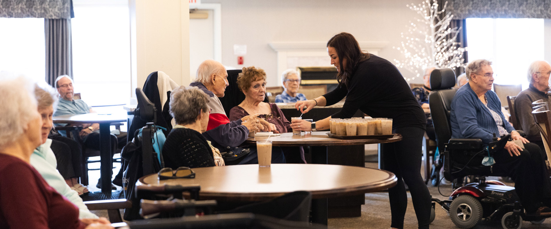 staff serving drinks to residents
