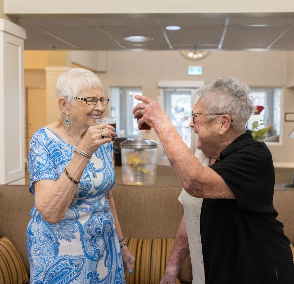 two residents cheersing