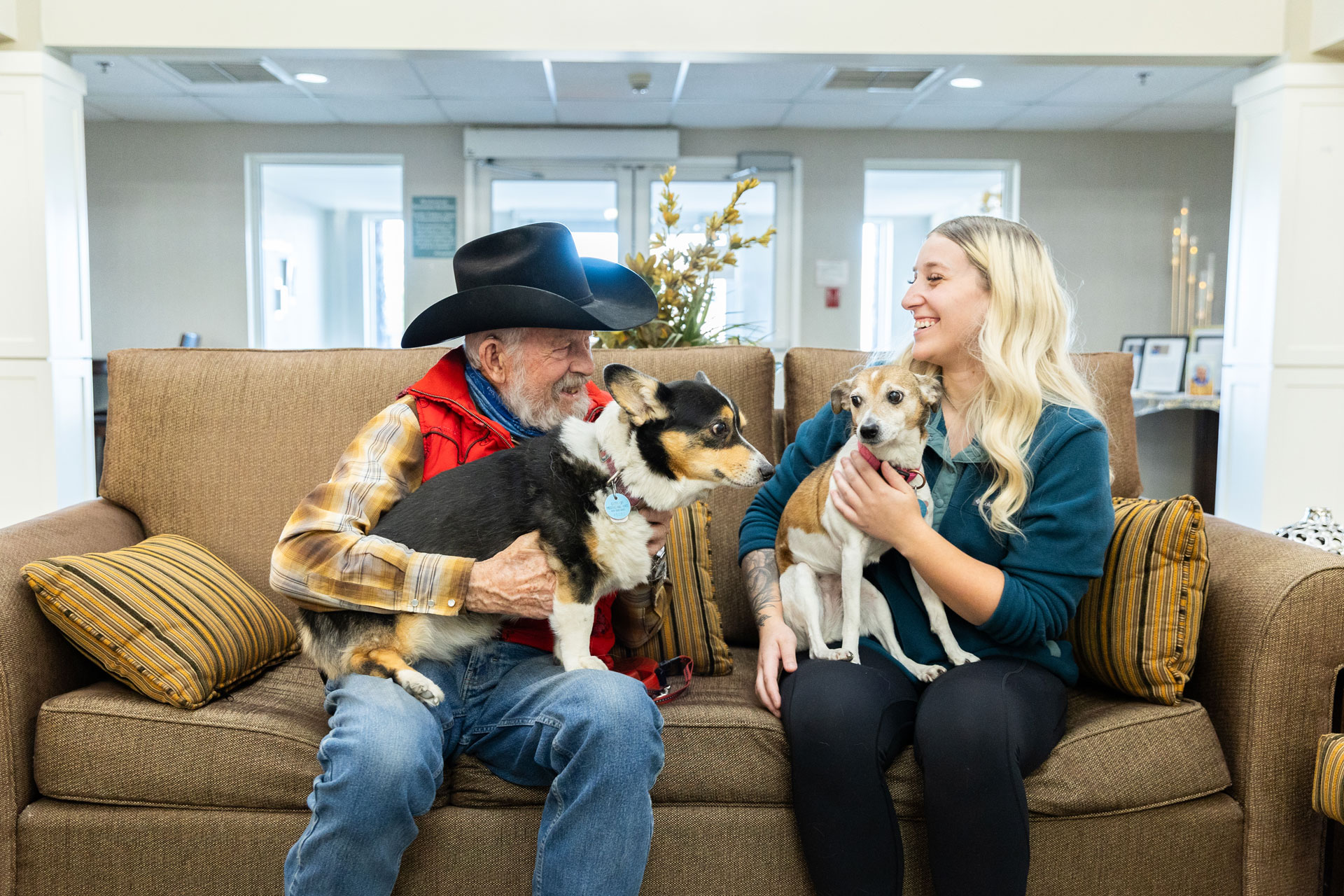 resident and team member with two dogs
