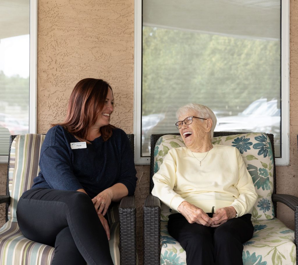 team member and resident laughing